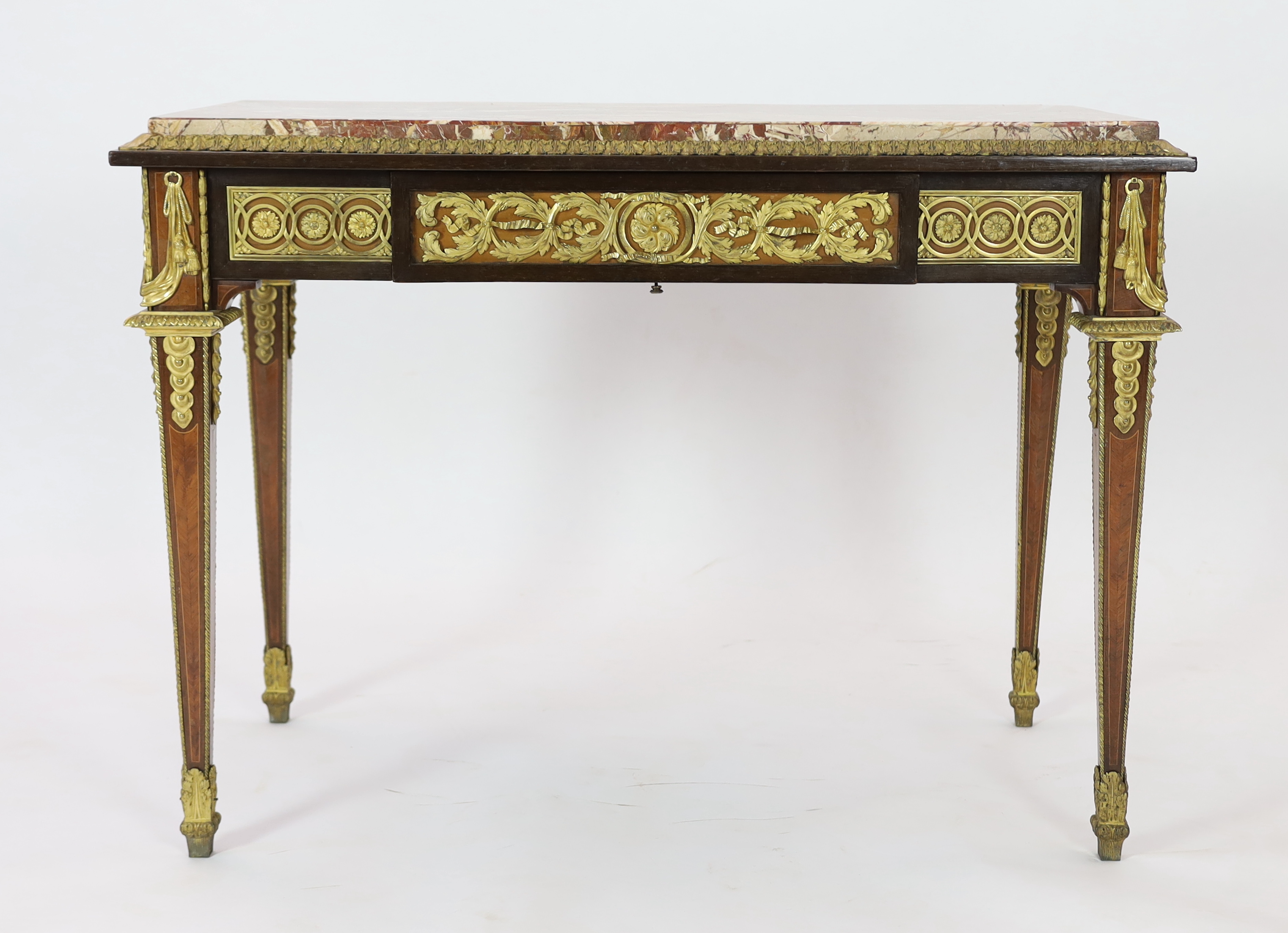 A late 19th century Louis XVI style ormolu mounted mahogany, bois satine and sycamore centre table, 113cm wide, 62cm deep, 82cm high, Please note this lot attracts an additional import tax of 5% on the hammer price